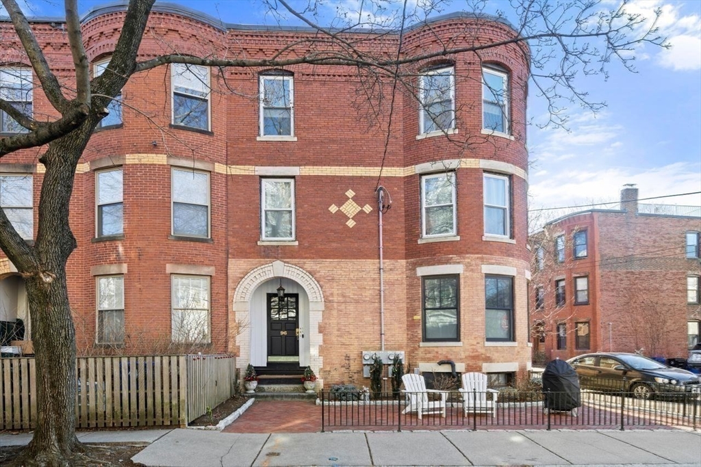 96 Brook Street, Unit 3 Brookline, MA 02445 - Photo 25 of 32 a front view of a brick building with many windows