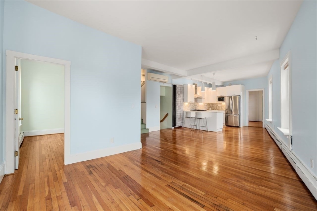 96 Brook Street, Unit 3 Brookline, MA 02445 - Photo 9 of 32 a view of a livingroom with wooden floor