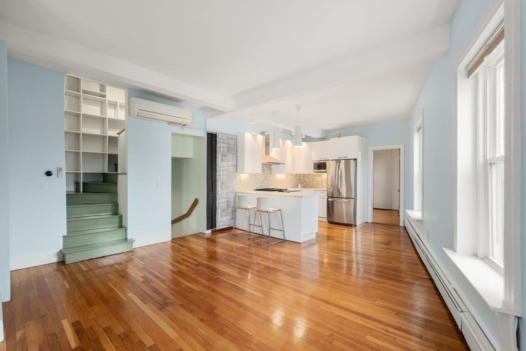 96 Brook Street, Unit 3 Brookline, MA 02445 - Photo 10 of 32 a open kitchen with white cabinets and stainless steel appliances