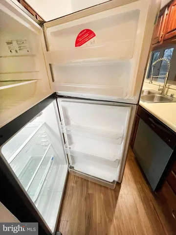 a refrigerator freezer sitting in a kitchen