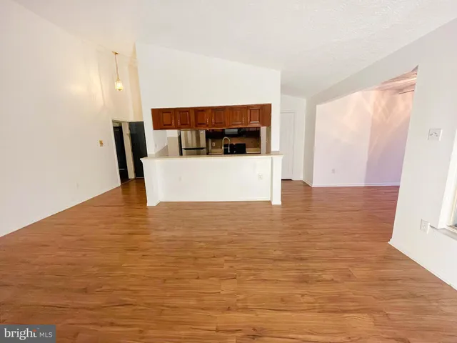a view of a kitchen from the hallway
