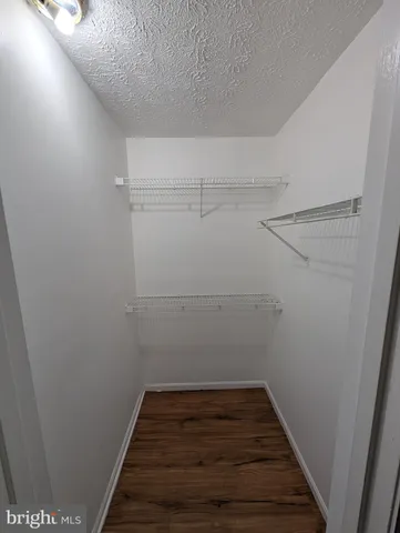 a view of a room with racks on the wall