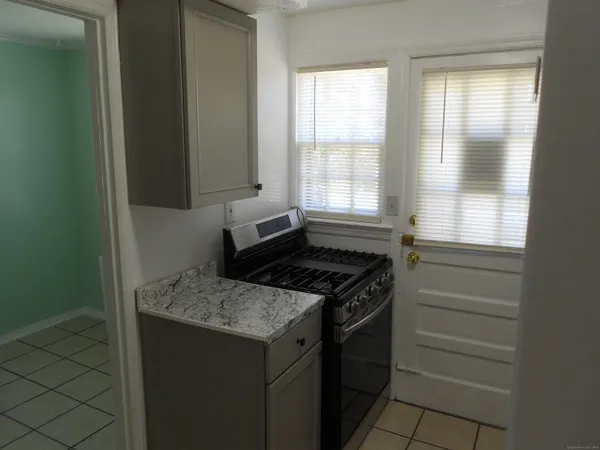 a kitchen with a stove and a cabinet