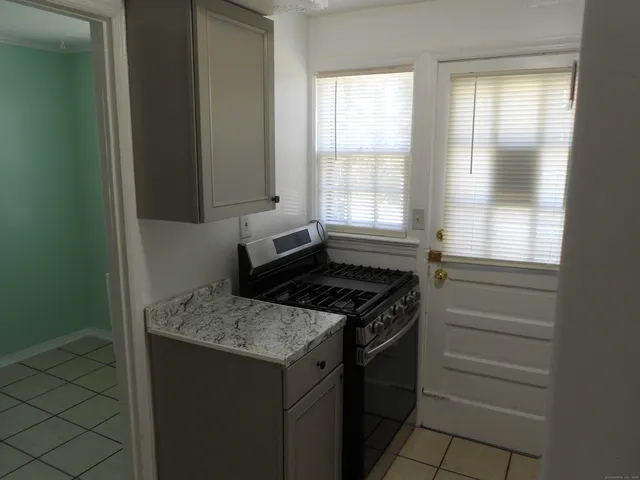 a kitchen with a stove and a cabinet