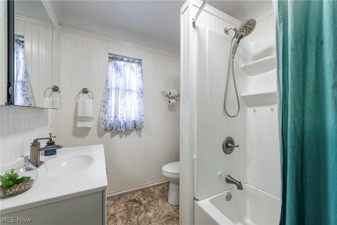 21779 Eaton Road Cleveland, OH 44126 - Photo 30 of 46 Full bathroom featuring crown molding, shower / bath combo, tile floors, toilet, and vanity