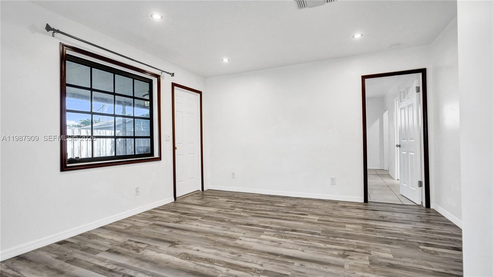 1007 North 31st Road Hollywood, FL 33021 - Photo 20 of 54 a view of empty room with wooden floor and fan