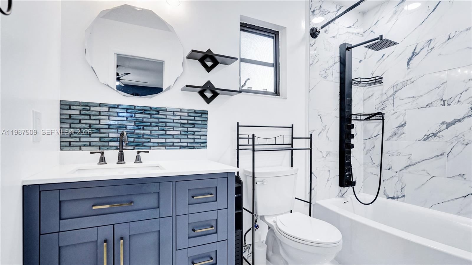 1007 North 31st Road Hollywood, FL 33021 - Photo 2 of 54 a bathroom with a sink toilet and shower