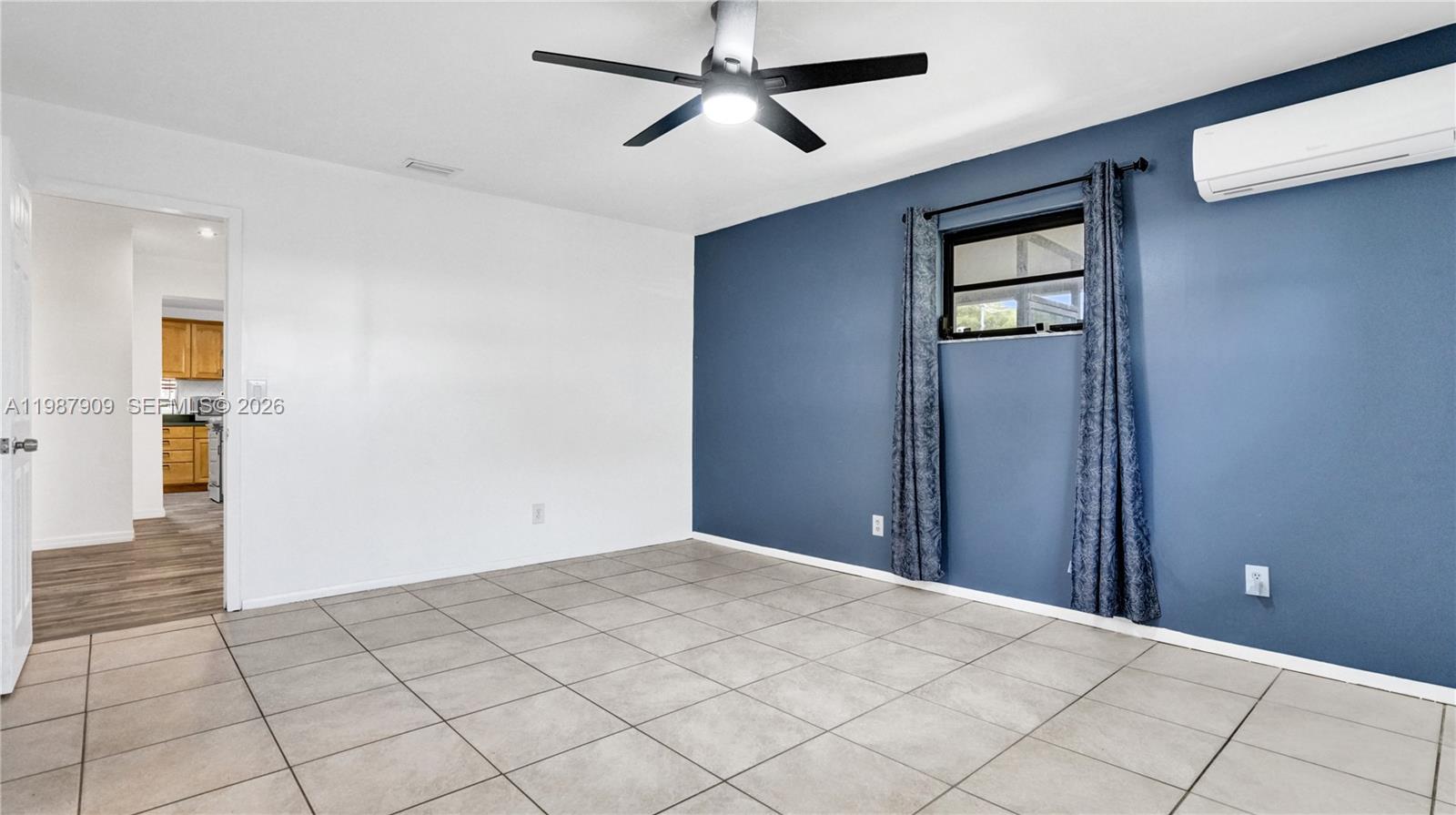 1007 North 31st Road Hollywood, FL 33021 - Photo 26 of 54 a view of a livingroom with a ceiling fan and window