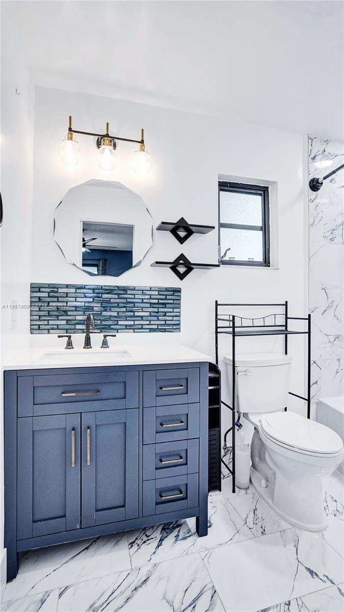 1007 North 31st Road Hollywood, FL 33021 - Photo 27 of 54 a bathroom with a toilet and a sink