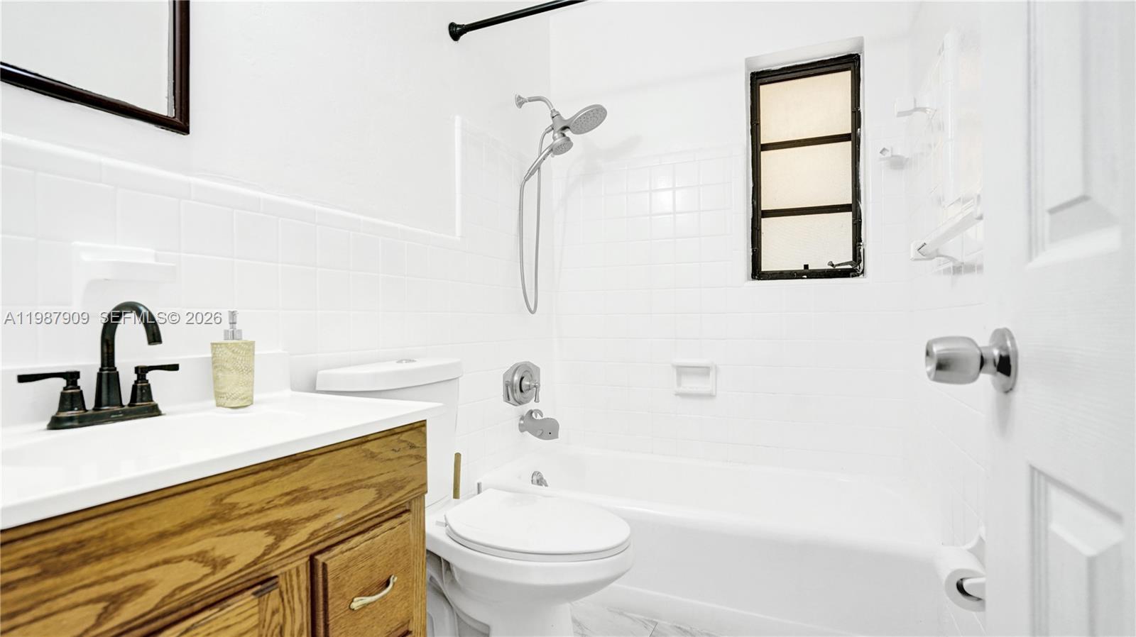 1007 North 31st Road Hollywood, FL 33021 - Photo 33 of 54 a bathroom with a sink a toilet and a bathtub