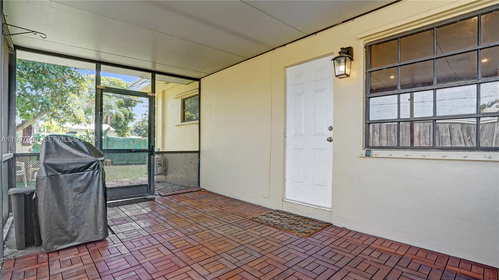 1007 North 31st Road Hollywood, FL 33021 - Photo 40 of 54 a view of a porch with wooden floor and outdoor space