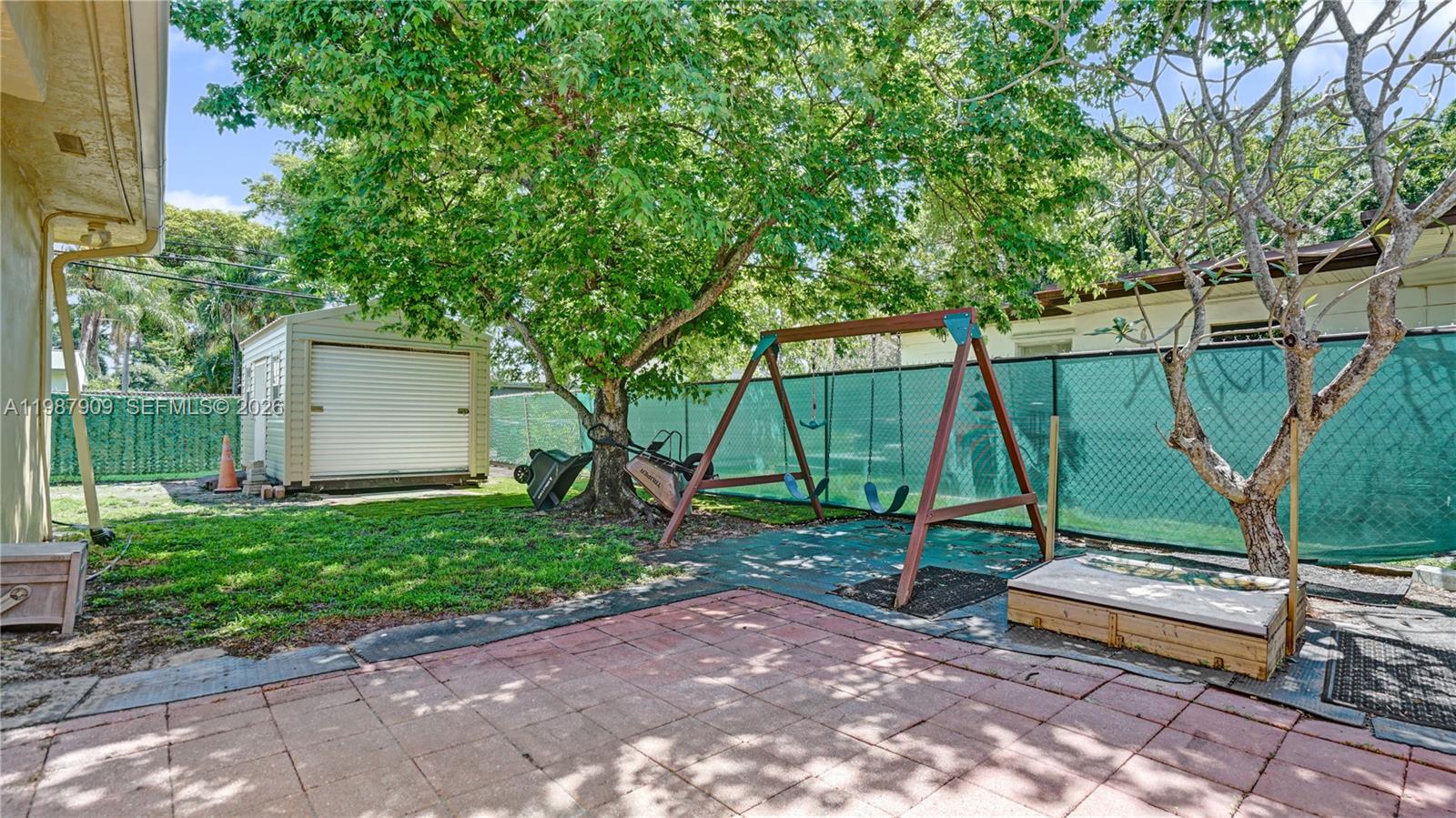 1007 North 31st Road Hollywood, FL 33021 - Photo 50 of 54 a view of a park with a bench and a slide