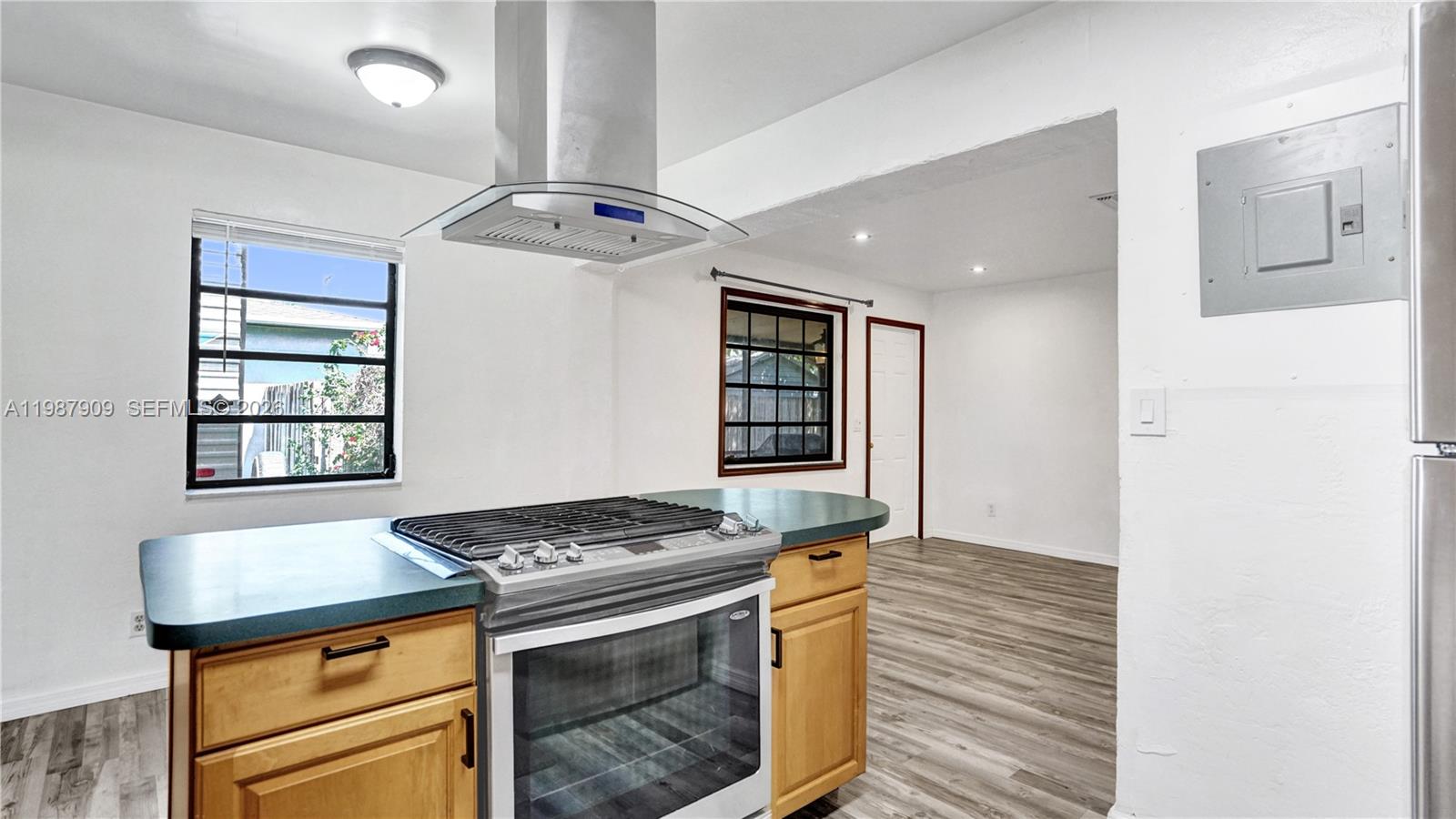 1007 North 31st Road Hollywood, FL 33021 - Photo 5 of 54 a kitchen with stainless steel appliances granite countertop a stove and a refrigerator