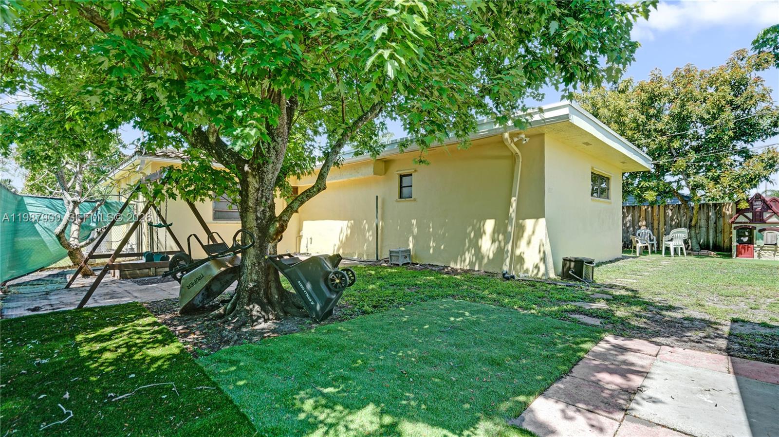 1007 North 31st Road Hollywood, FL 33021 - Photo 53 of 54 a backyard of a house with table and chairs