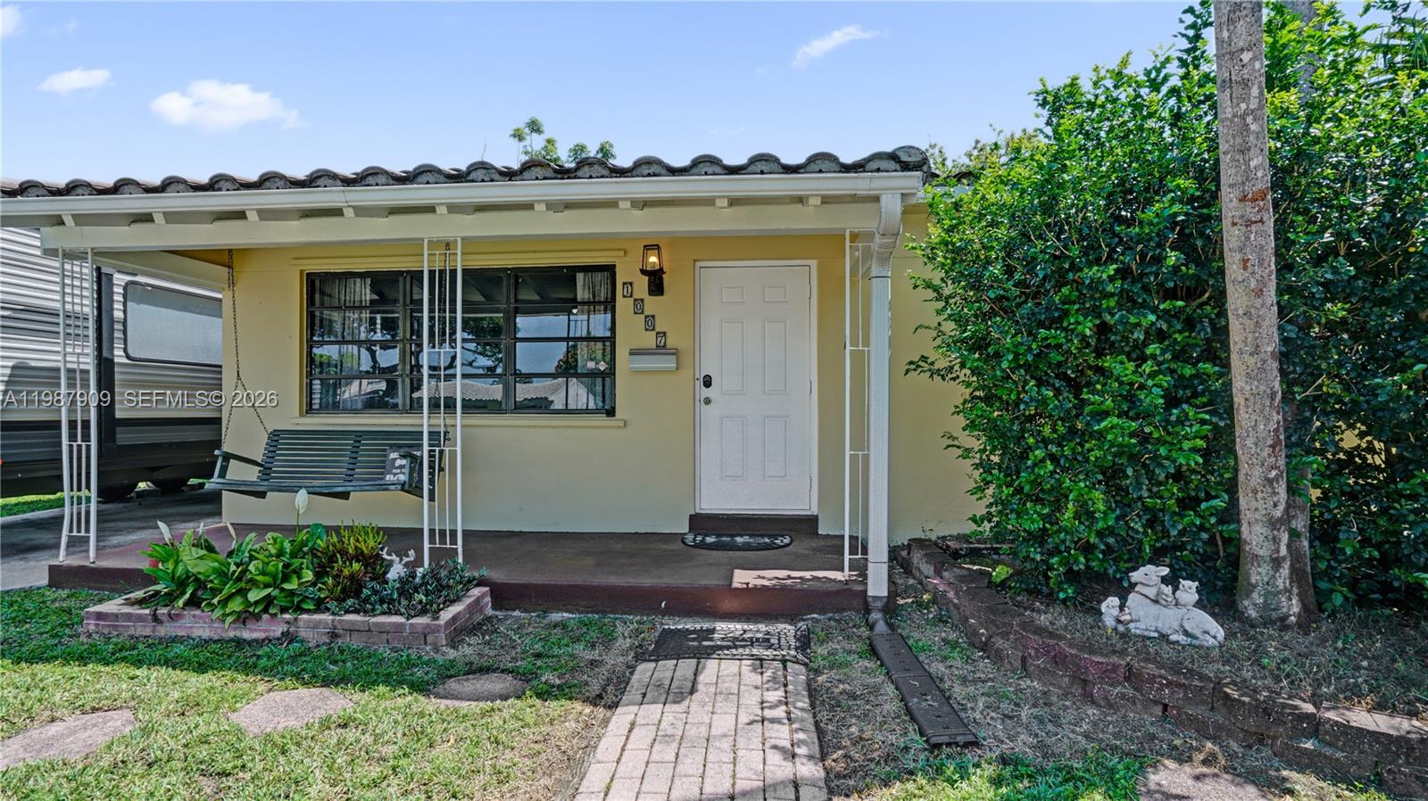 1007 North 31st Road Hollywood, FL 33021 - Photo 9 of 54 a front view of a house with a yard