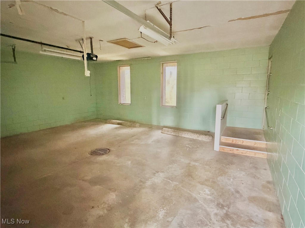 2898 Canton Road Uniontown, OH 44685 - Photo 6 of 20 Garage featuring concrete block wall