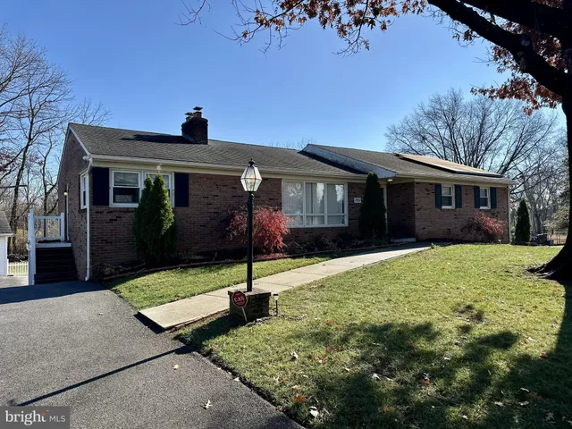 a front view of house with yard outdoor seating and barbeque oven