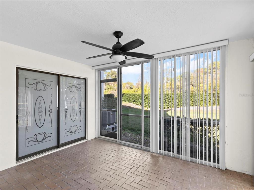 2737 Enterprise Road East, Unit 111 Clearwater, FL 33759 - Photo 17 of 28 a view of a hallway with wooden door and front door