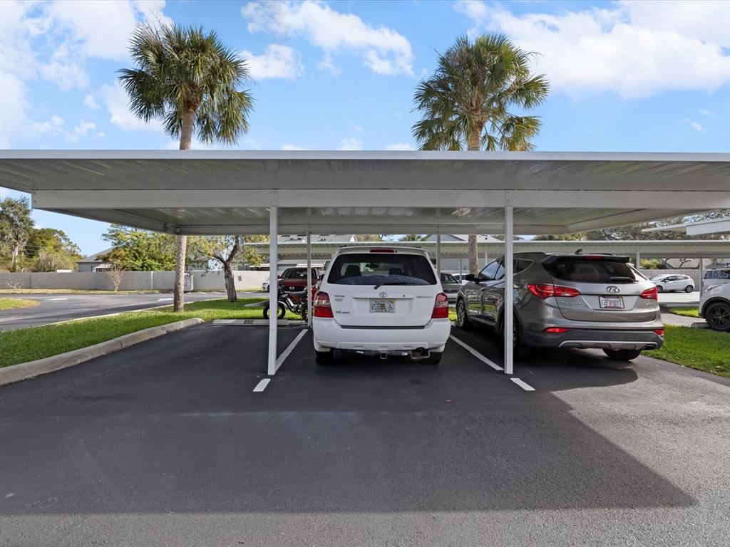 2737 Enterprise Road East, Unit 111 Clearwater, FL 33759 - Photo 19 of 28 a view of car parking