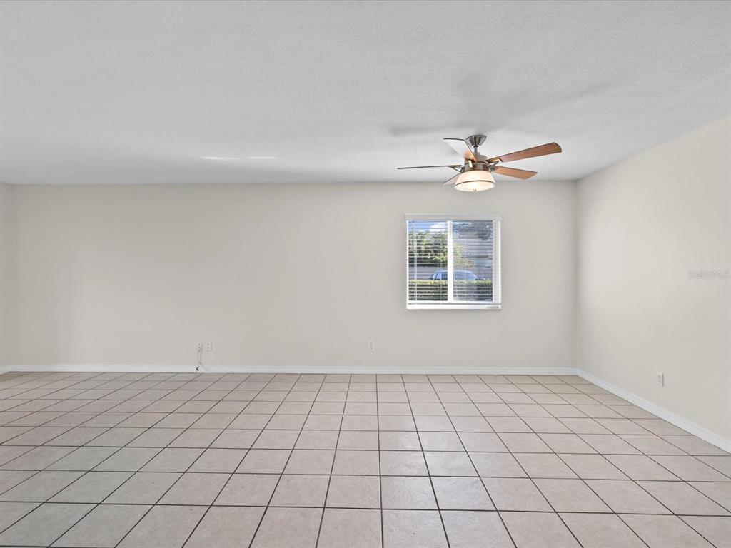 2737 Enterprise Road East, Unit 111 Clearwater, FL 33759 - Photo 20 of 28 a view of an empty room with a window