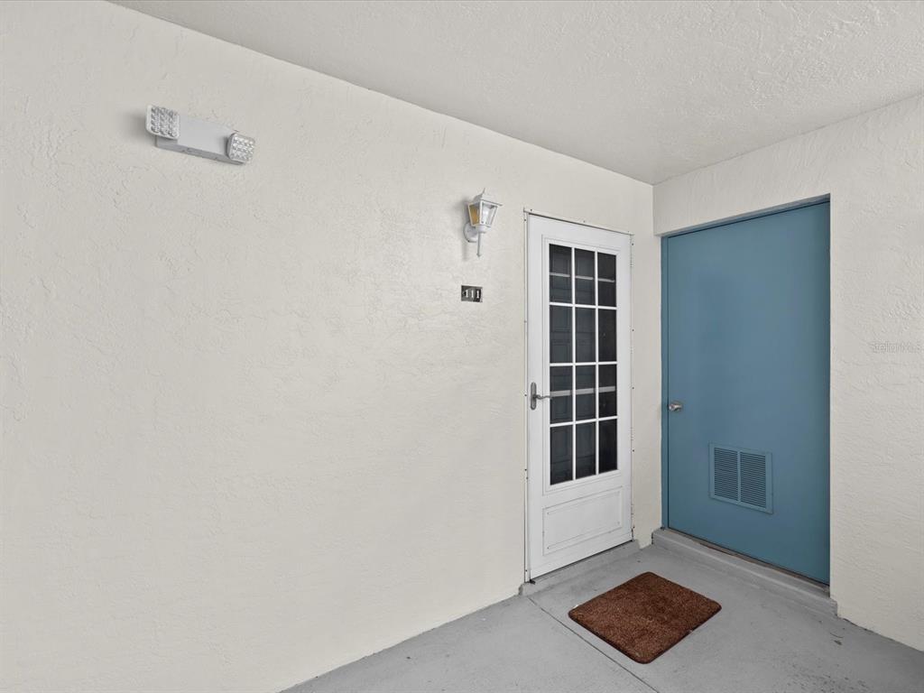 2737 Enterprise Road East, Unit 111 Clearwater, FL 33759 - Photo 2 of 28 a view of an empty room with a window