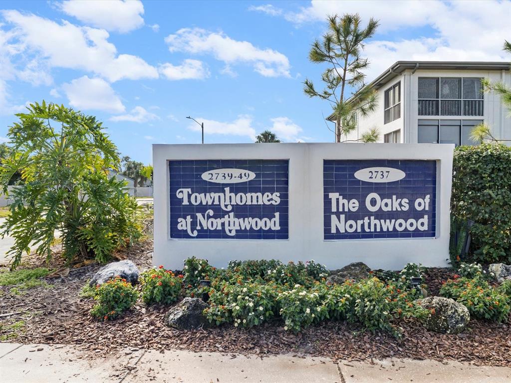 2737 Enterprise Road East, Unit 111 Clearwater, FL 33759 - Photo 22 of 28 a sign on the side of a building