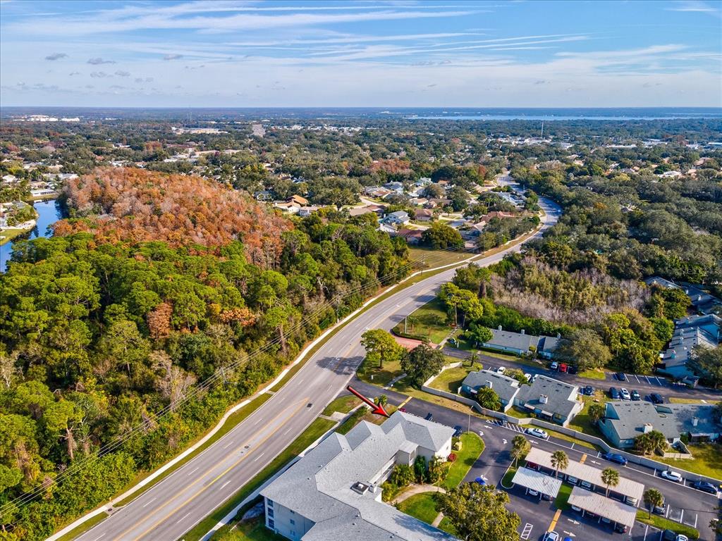 2737 Enterprise Road East, Unit 111 Clearwater, FL 33759 - Photo 26 of 28 an aerial view of multiple house