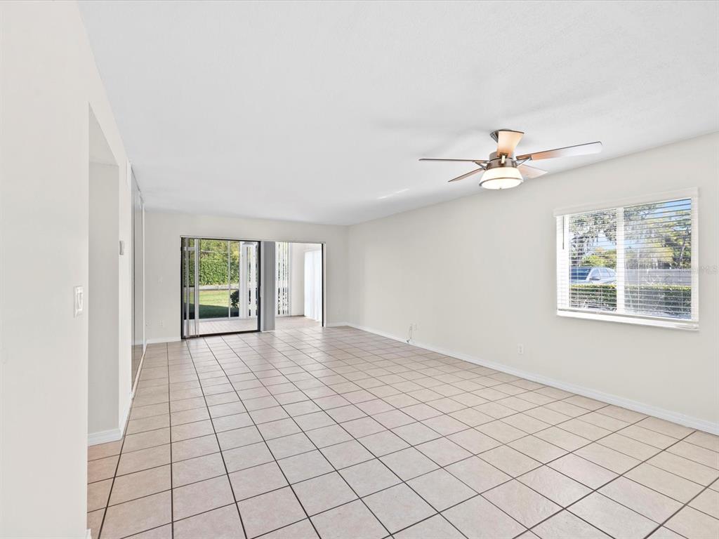 2737 Enterprise Road East, Unit 111 Clearwater, FL 33759 - Photo 4 of 28 a view of an empty room with a window