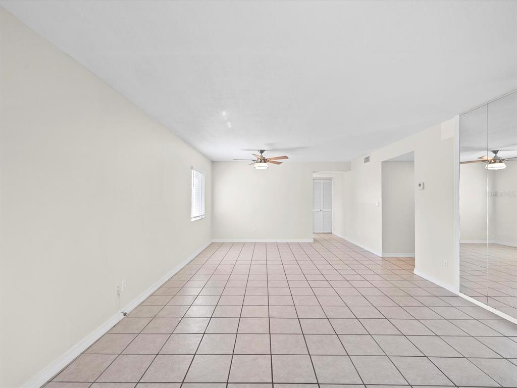 2737 Enterprise Road East, Unit 111 Clearwater, FL 33759 - Photo 5 of 28 a view of an empty room and window