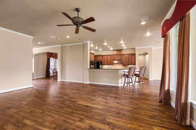 a view of a dining room with furniture and wooden floor