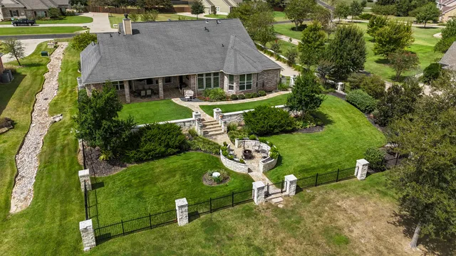 an aerial view of a house with a garden