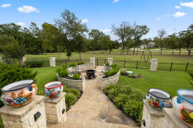 a view of a table and chairs in the garden
