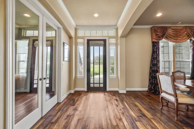 a view of entryway with wooden floor