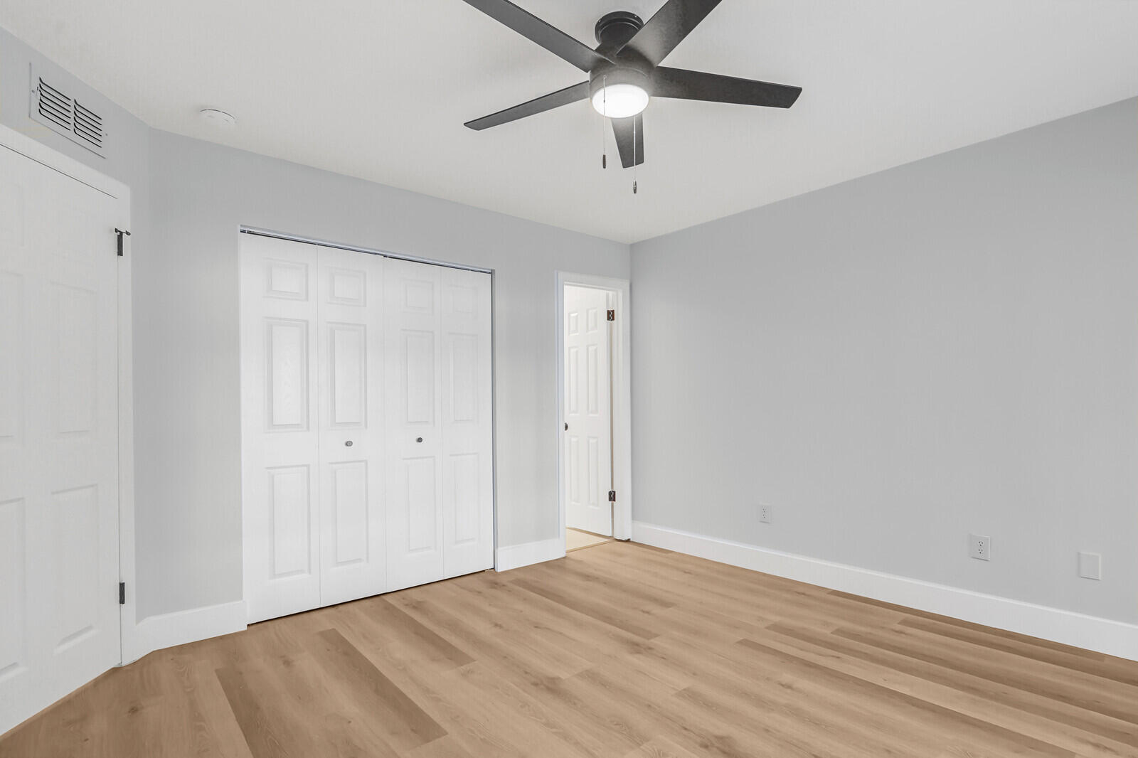 2929 Southeast Ocean Boulevard, Unit E1 Stuart, FL 34996 - Photo 19 of 37 wooden floor in an empty room