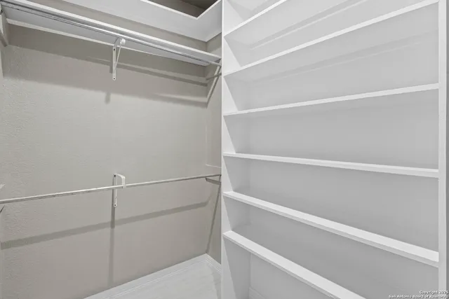 a view of an empty walk in closet