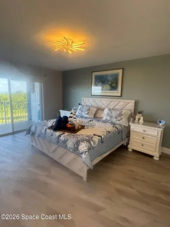 a bedroom with bed and window