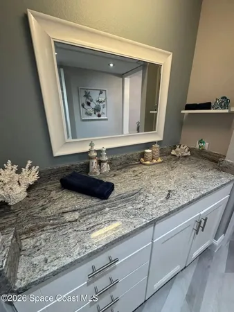 a bathroom with a tub and shower