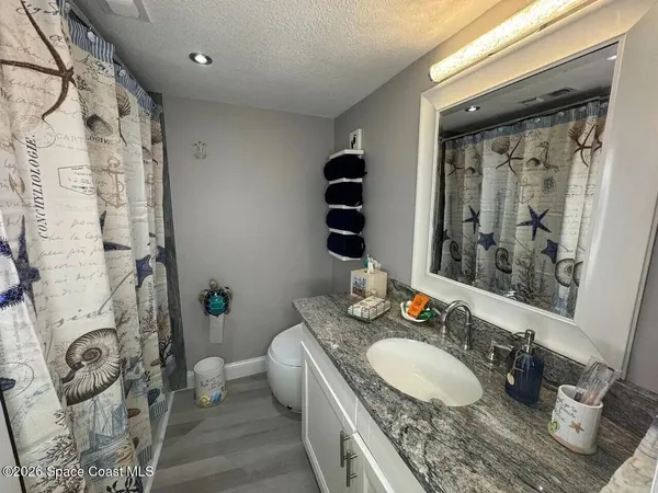 a bedroom with a bed and lamp