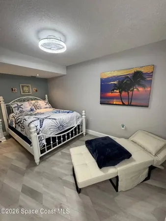 a room with furniture and a flat screen tv