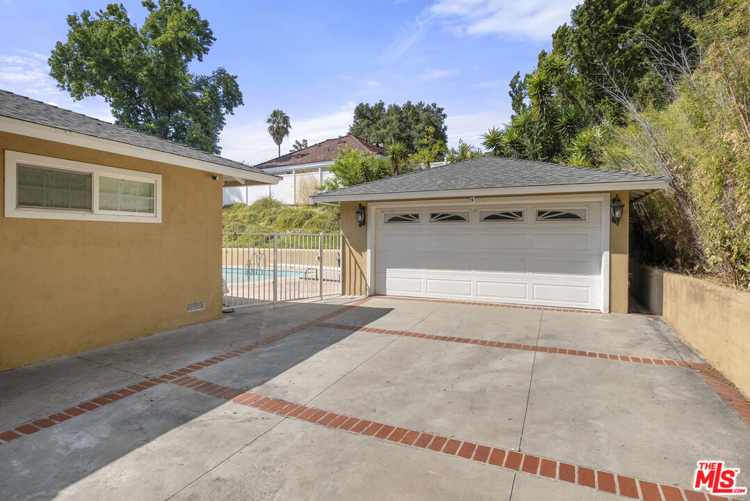 1823 Fern Lane Glendale, CA 91208 - Photo 30 of 30 a front view of a house with a yard and garage