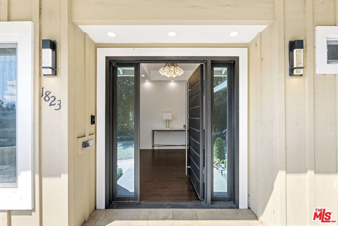 1823 Fern Lane Glendale, CA 91208 - Photo 4 of 30 a view of a hallway with wooden floor windows and a living room
