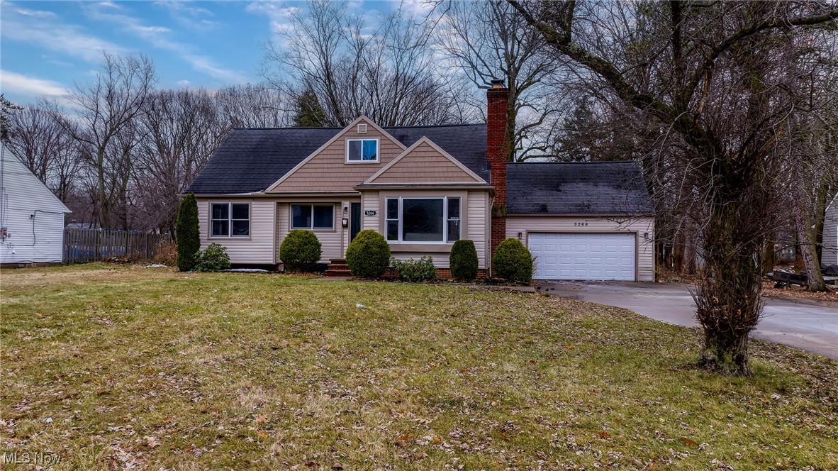 5266 Wilson Mills Road Cleveland, OH 44143 - Photo 41 of 50 View of front of home with a shingled roof, driveway, a chimney, and a garage