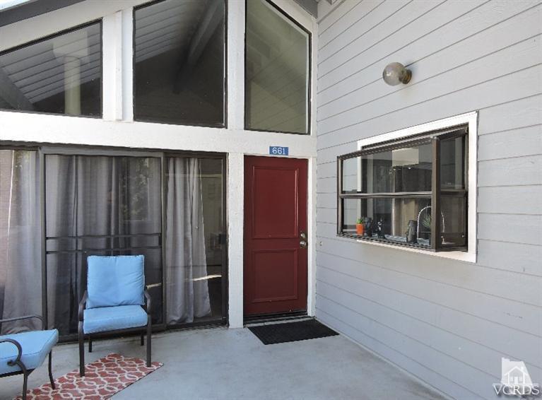 661 Arneill Road Camarillo, CA 93010 - Photo 22 of 22 a view of a door and chair in the balcony