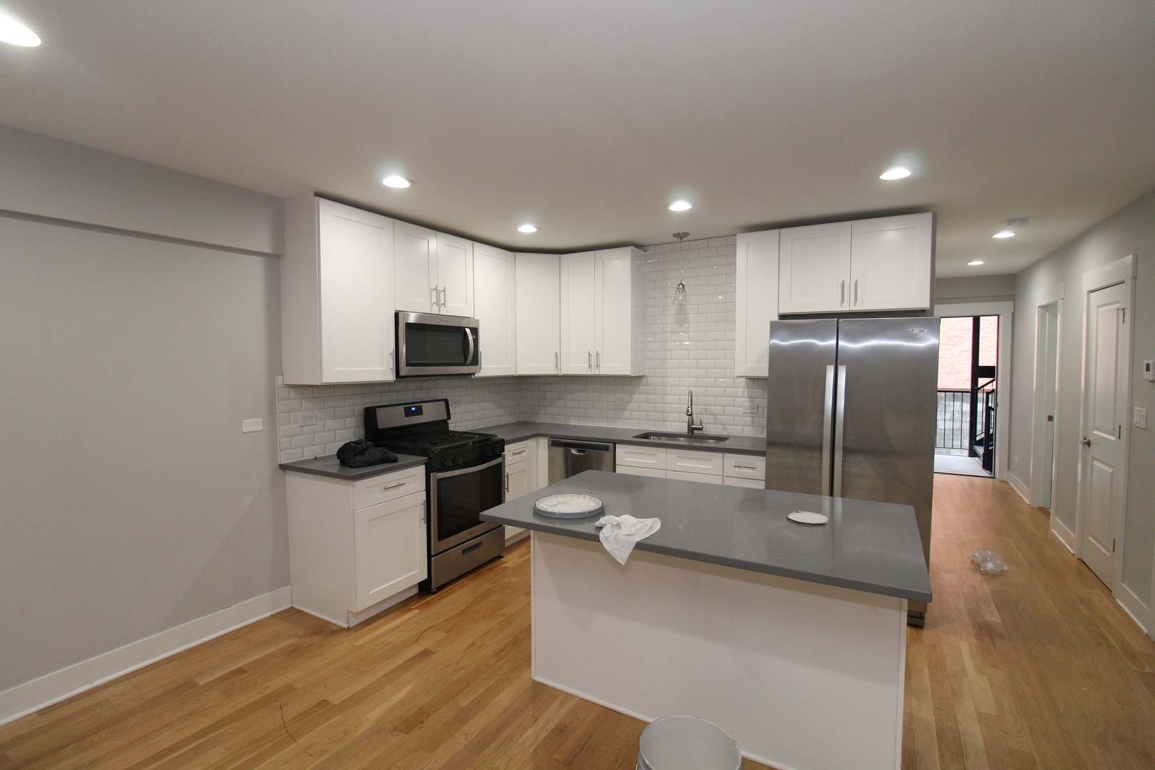 1411 West Taylor Street Chicago, IL 60607 - Photo 3 of 18 a kitchen with a sink stainless steel appliances and counter space