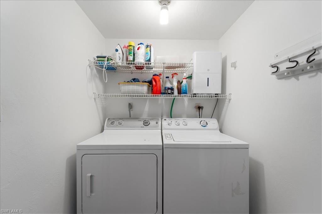 307 Goodlette-Frank Road, Unit B202 Naples, FL 34102 - Photo 16 of 32 a utility room with dryer and washer