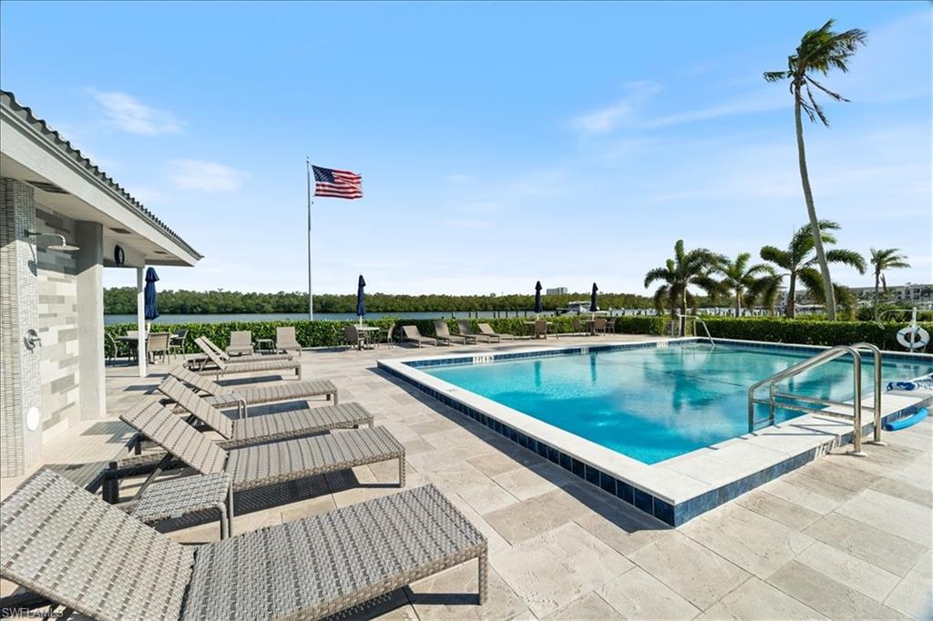 307 Goodlette-Frank Road, Unit B202 Naples, FL 34102 - Photo 4 of 32 a view of a terrace with couches and sky view