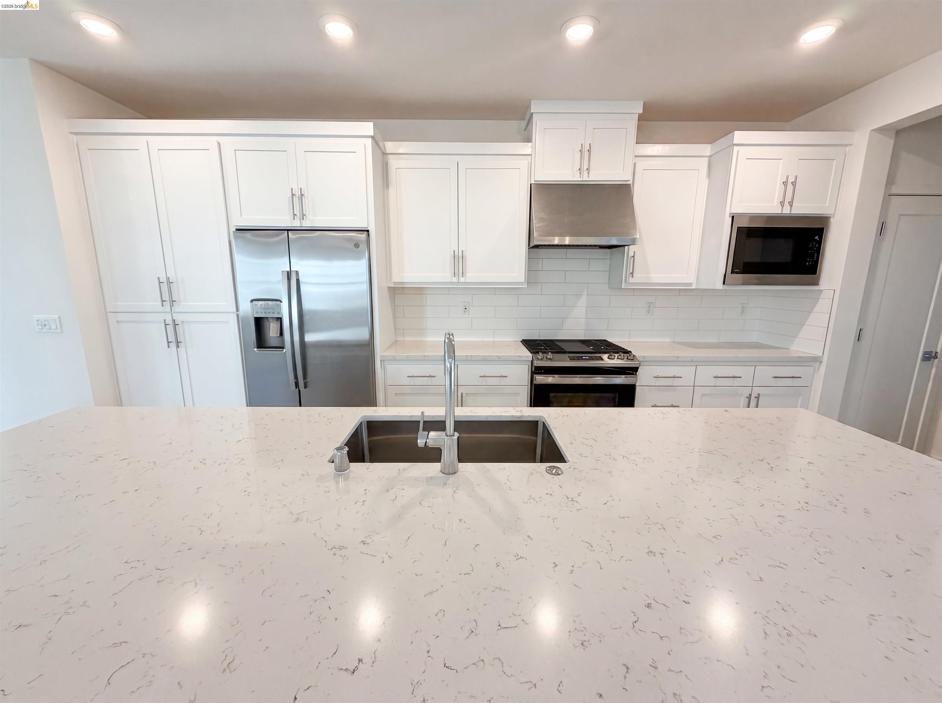 9034 Rudder Way Newark, CA 94560 - Photo 30 of 38 Expansive kitchen island featuring an undermount stainless steel sink