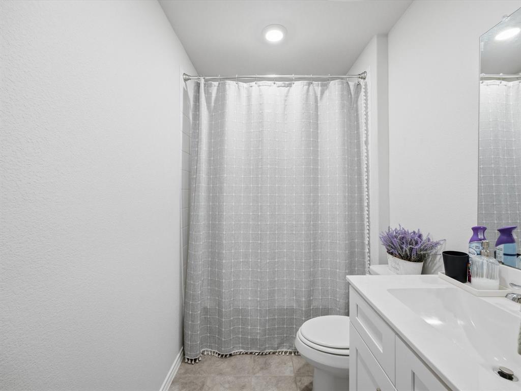 521 Bronze Circle East Springtown, TX 76082 - Photo 18 of 22 a bathroom with a sink toilet and shower