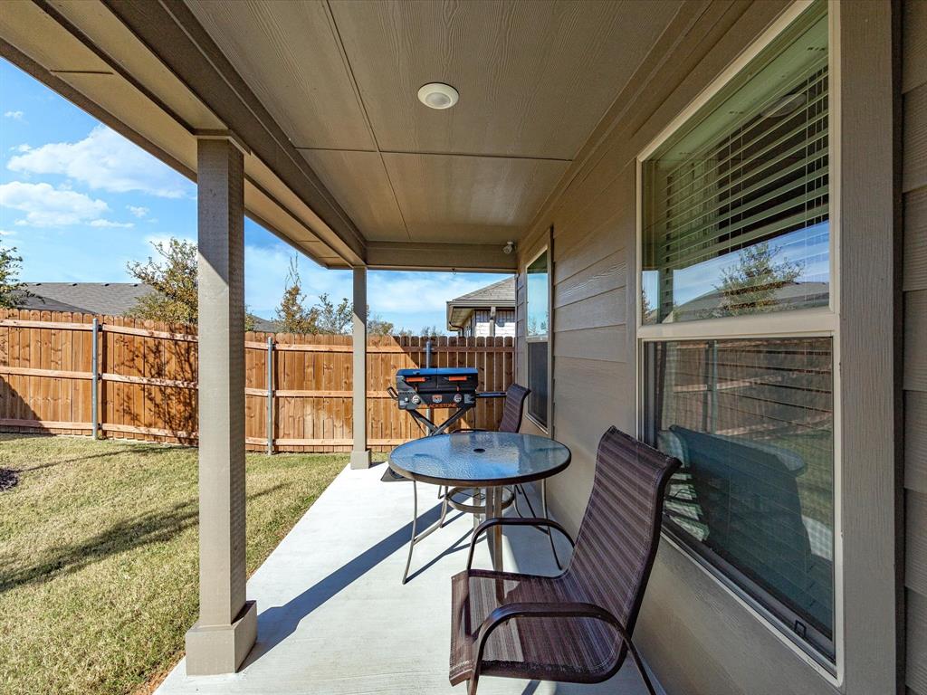 521 Bronze Circle East Springtown, TX 76082 - Photo 22 of 22 a balcony with table and chairs