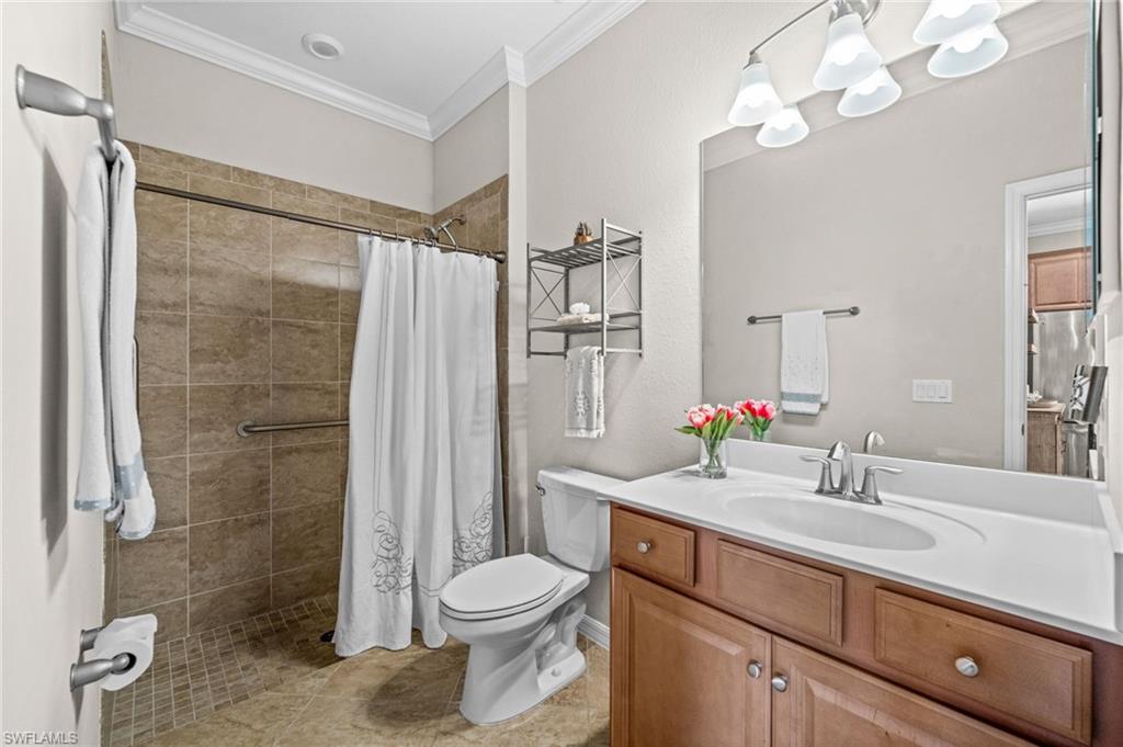 4754 Abaca Circle Naples, FL 34119 - Photo 33 of 46 a bathroom with a sink a toilet and shower